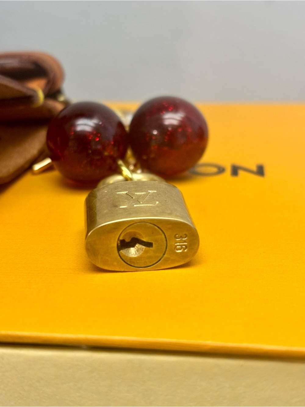 Louis Vuitton Brass Lock, LV Poignet, Red Cherry, Clover Bag Charm, 5.25 in. - Picture 6 of 6